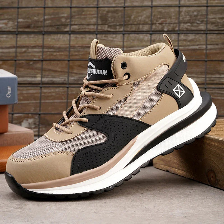 Beige and black high-top sneaker with mesh and leather details on concrete floor with wooden and metal background