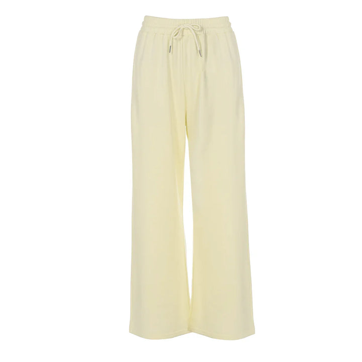 Cream wide-leg lounge pants with elastic waistband and drawstring against white background