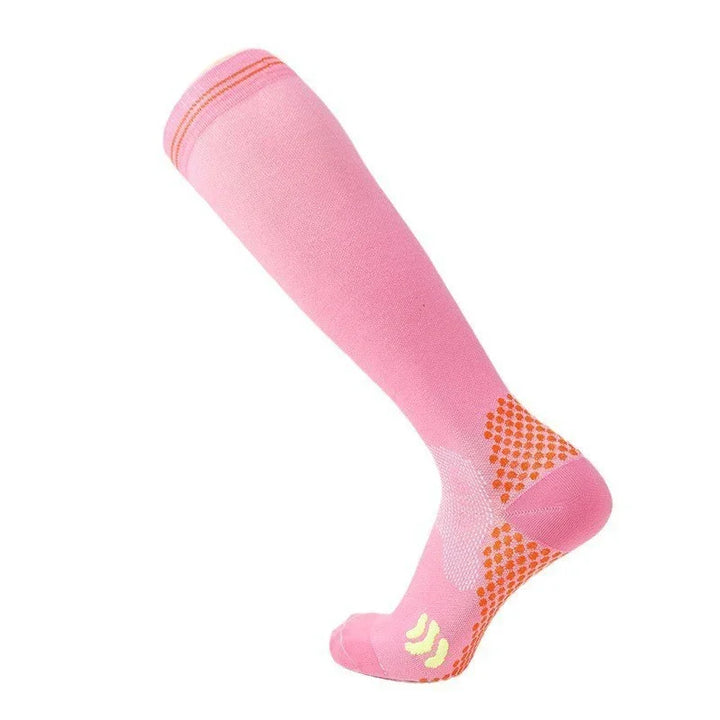 pink compression knee-high sock with orange grip dots and yellow accents on foot