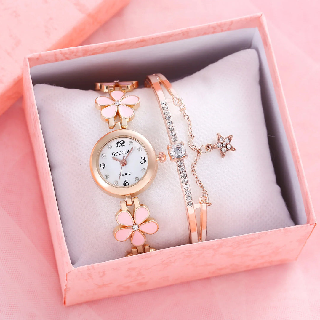 Rose gold women's watch with pink flower design and rhinestone bracelet in pink gift box