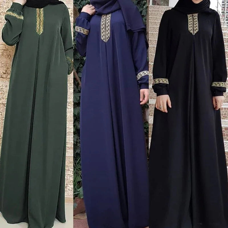 Three women wearing elegant long abayas in green, navy, and black with gold embroidery on sleeves and neckline