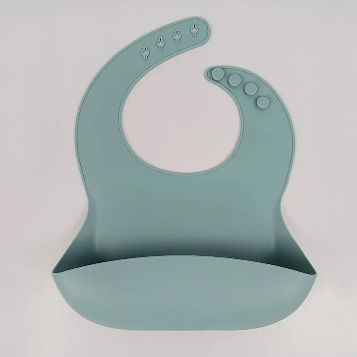 Blue silicone baby bib with adjustable snap buttons and food crumb catcher