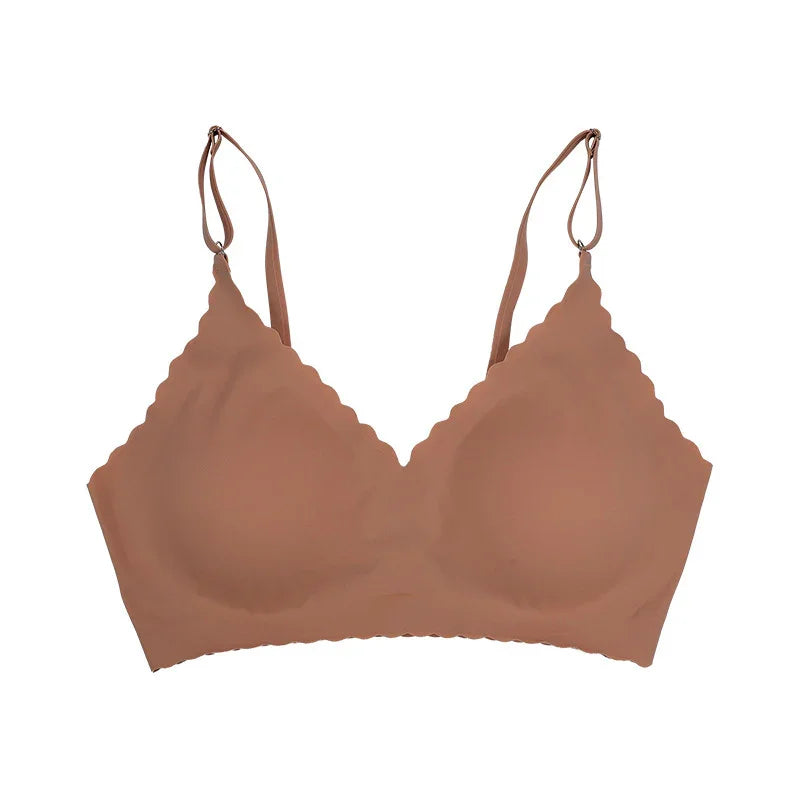 Seamless brown wireless bra with scalloped edges and adjustable straps on white background