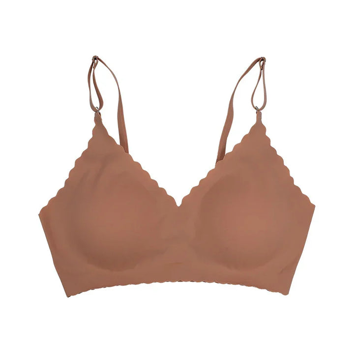 Seamless brown wireless bra with scalloped edges and adjustable straps on white background
