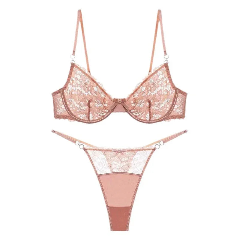 pink lace bra and matching thong lingerie set with floral pattern on white background