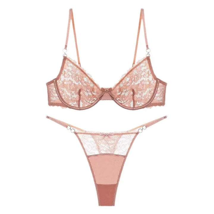 pink lace bra and matching thong lingerie set with floral pattern on white background