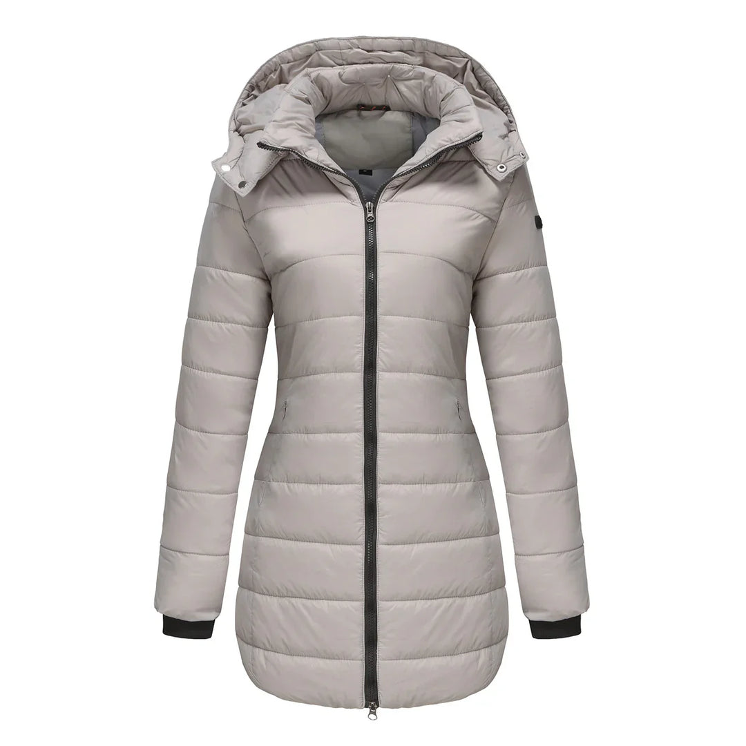 Light gray women's quilted puffer jacket with hood and black zipper on white background