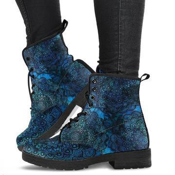 Blue and black patterned lace-up ankle boots worn with black skinny jeans