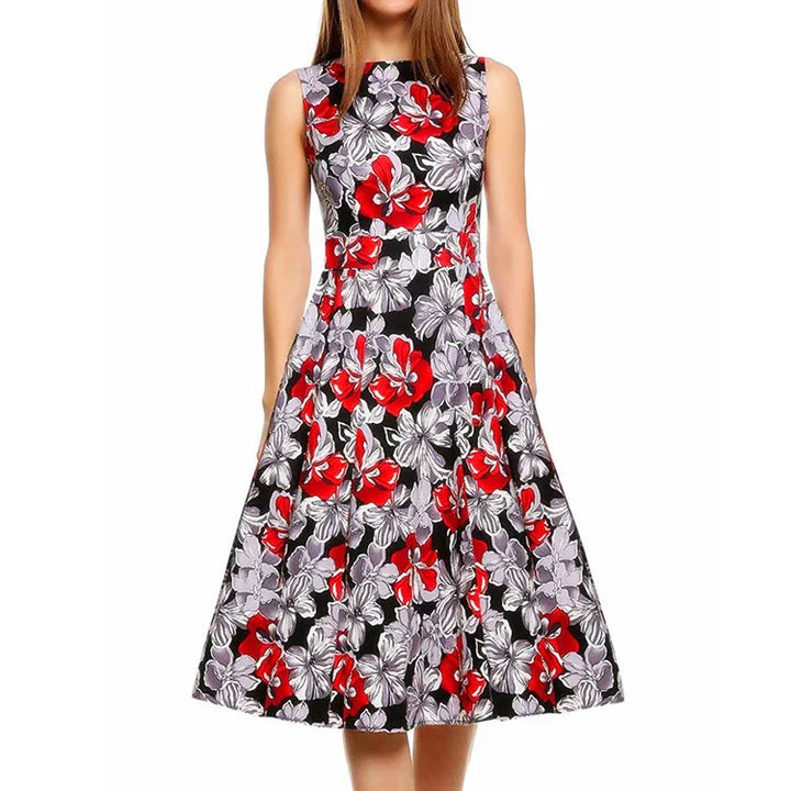 Sleeveless black midi dress with bold red and gray floral print, fitted waist and flared skirt