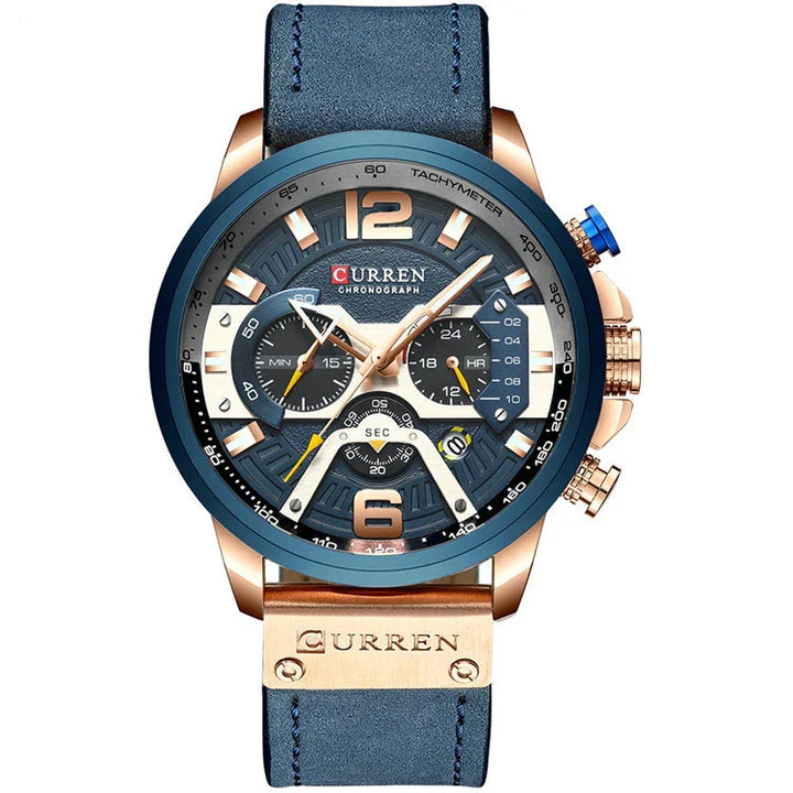 Curren chronograph men's wristwatch with blue dial, gold accents, tachymeter bezel, and blue leather strap