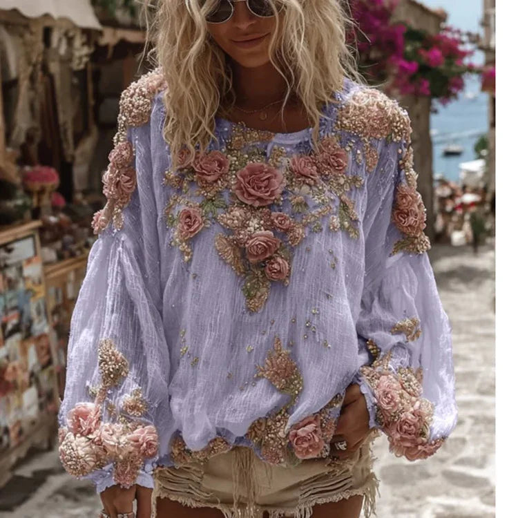 Woman wearing lavender blouse with pink floral embroidery and distressed beige shorts on sunny street