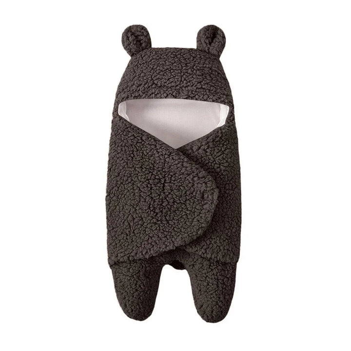 Black baby swaddle blanket with bear ears made of soft sherpa fleece