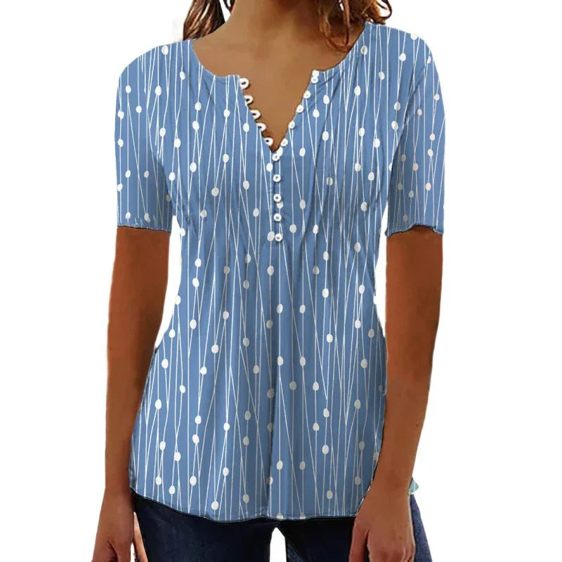 Woman wearing blue short-sleeve blouse with white dotted line pattern and buttoned V-neck