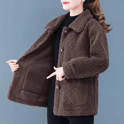 woman wearing brown sherpa fleece button-up jacket showing jacket interior pocket