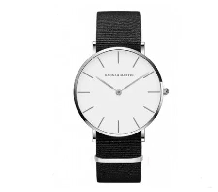 Minimalist Hannah Martin wristwatch with silver case, white dial, and black nylon strap