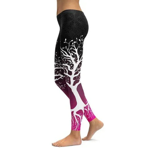 Side view of woman wearing black and pink leggings with white tree and root design on white background