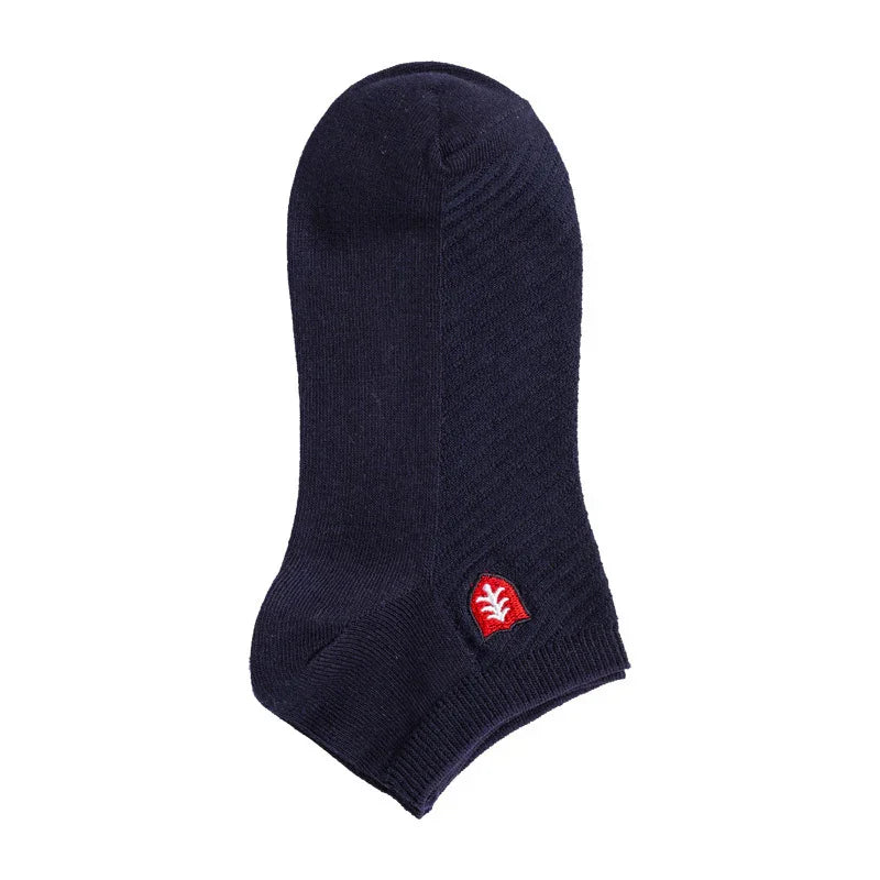 Single navy blue ankle sock with red and white leaf logo on white background