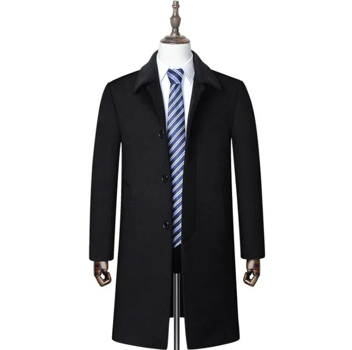 Black men's formal overcoat on mannequin with white shirt and blue striped tie