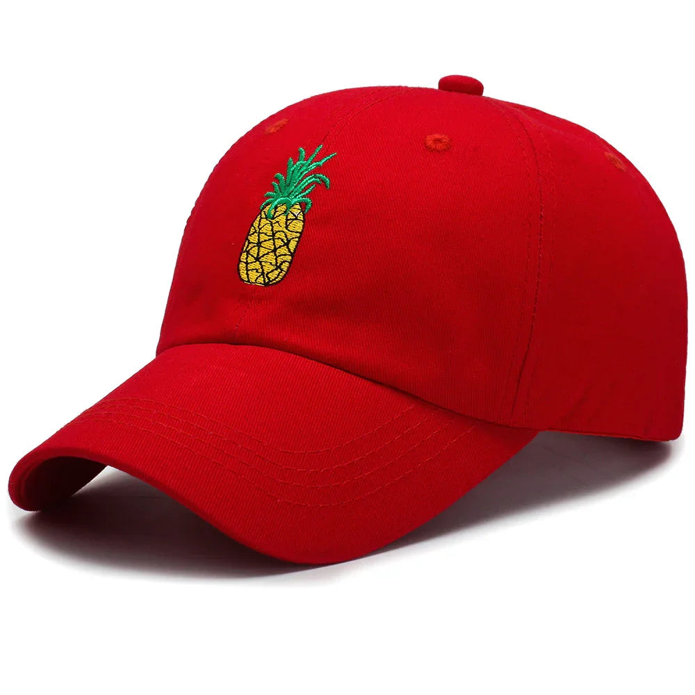 Red baseball cap with embroidered yellow pineapple and green leaves on front