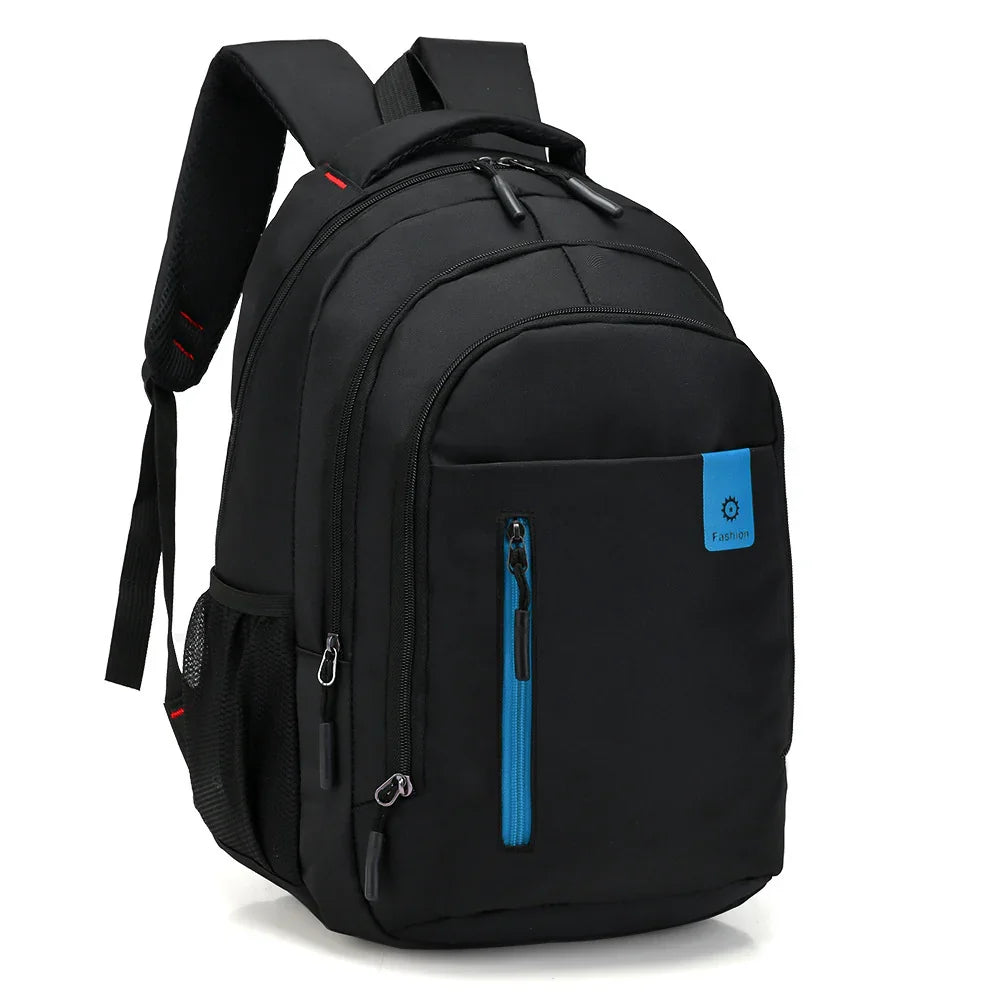 Black fabric backpack with multiple compartments, blue zipper pocket, padded straps, and mesh side pocket