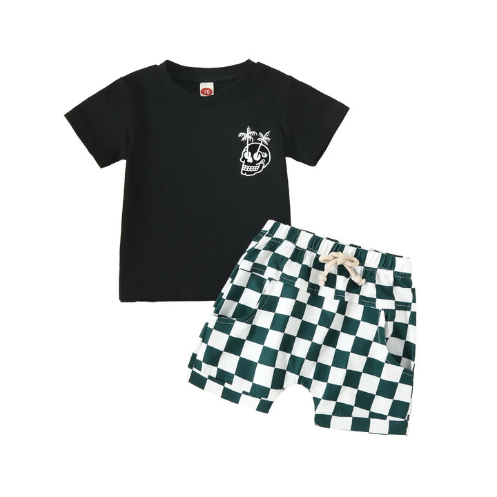 Black toddler t-shirt with skull and palm trees print paired with green and white checkered shorts