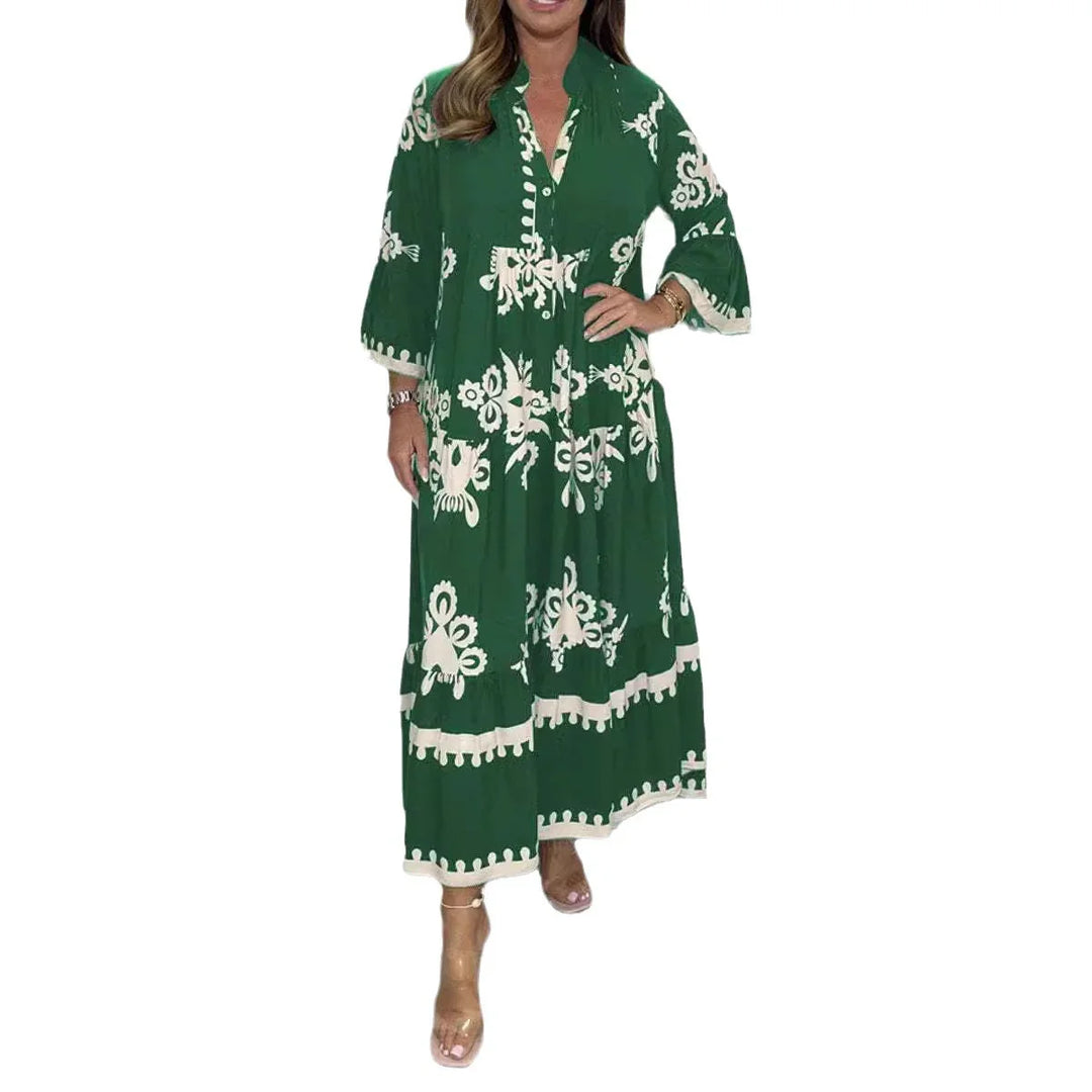 Woman wearing a green maxi dress with white floral patterns and long sleeves