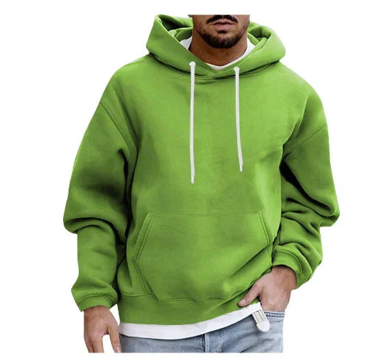Man wearing bright green hooded sweatshirt with white drawstrings and front pocket
