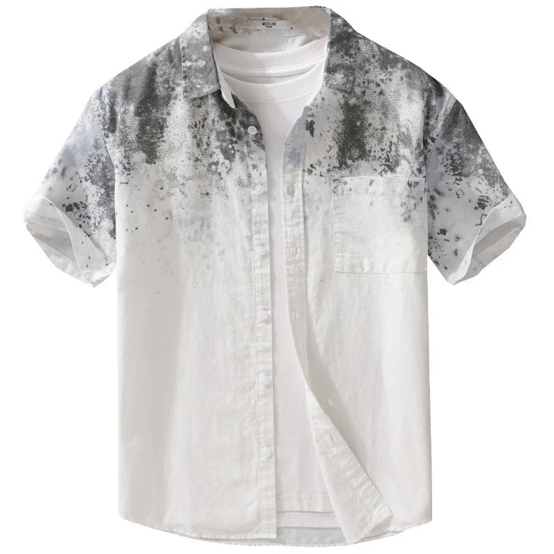 Men's white short-sleeve button-up shirt with black and gray splatter pattern on shoulders and chest