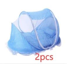 Two blue mosquito nets with white trim neatly folded against a white background