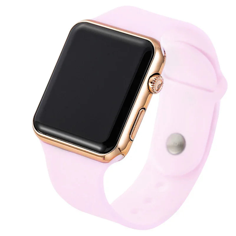 Rose gold smartwatch with a black screen and soft pink silicone band on white background