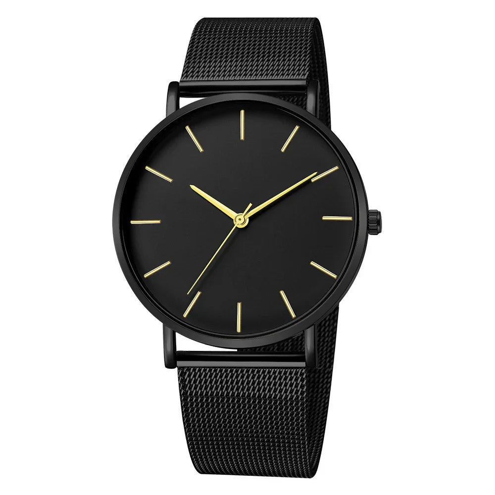 Minimalist black wristwatch with gold hour markers and mesh strap