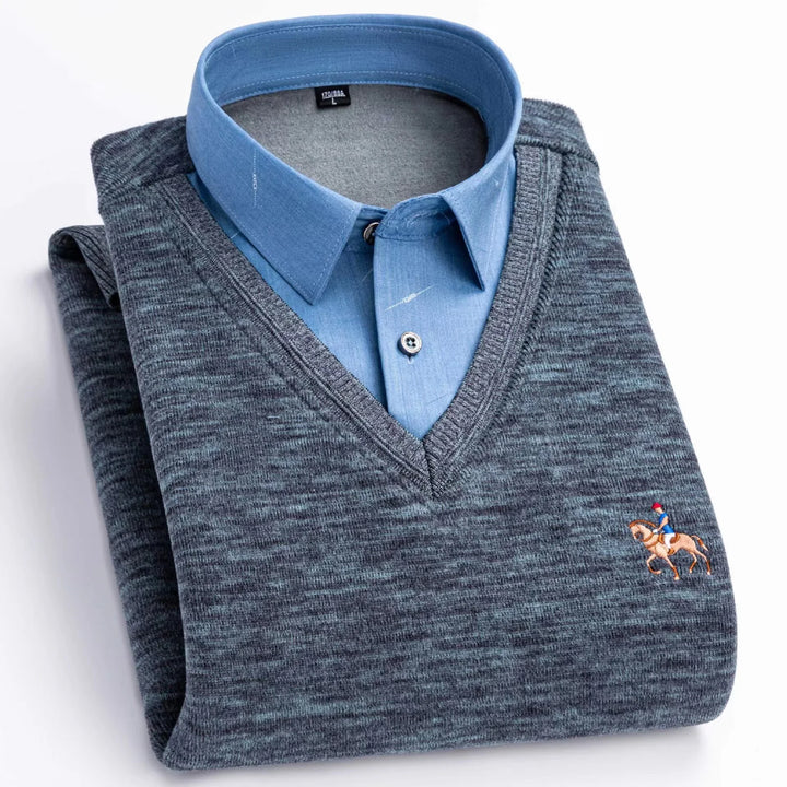 Folded men's blue dress shirt with grey V-neck sweater featuring horse rider embroidery