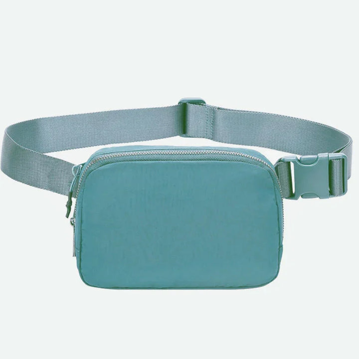 Minimalist light blue fabric waist bag with adjustable strap and front zipper pocket