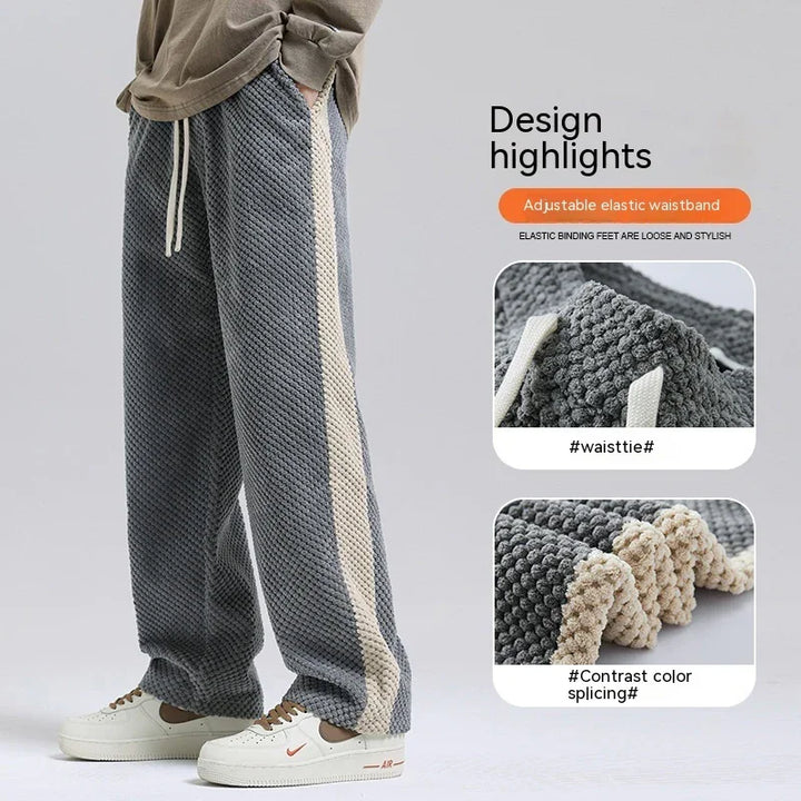 Gray knit pants with beige side stripe, adjustable elastic waistband, and textured fabric detail