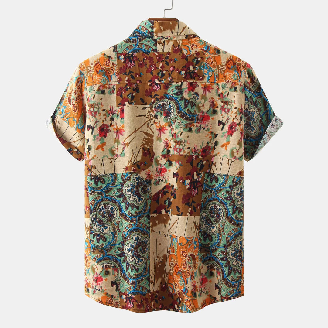 Back view of colorful patchwork short sleeve shirt with floral and paisley patterns