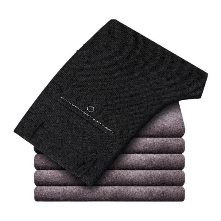 Stack of folded purple and black knit sweaters with button detail on sleeve
