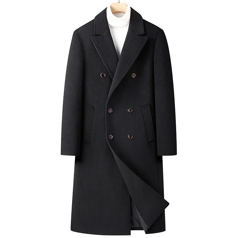 Black double-breasted wool coat with notch lapels on wooden hanger over white turtleneck sweater