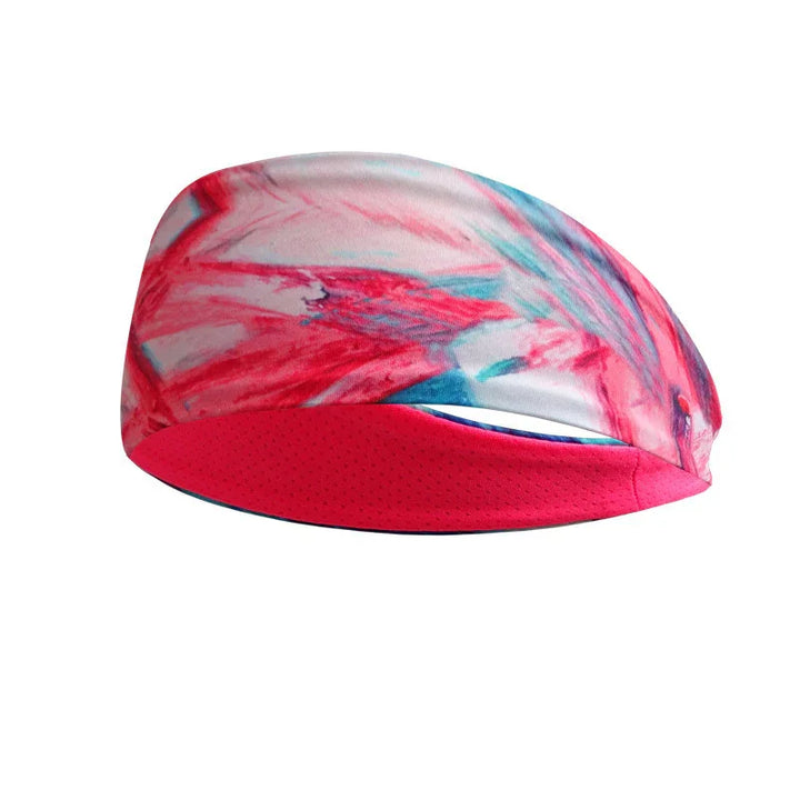 Pink and white cycling cap with abstract red and blue brushstroke design and a solid pink underside