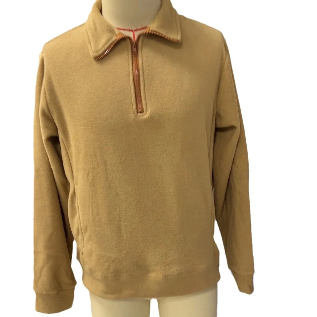 Beige quarter-zip fleece pullover with a stand collar and long sleeves on a mannequin