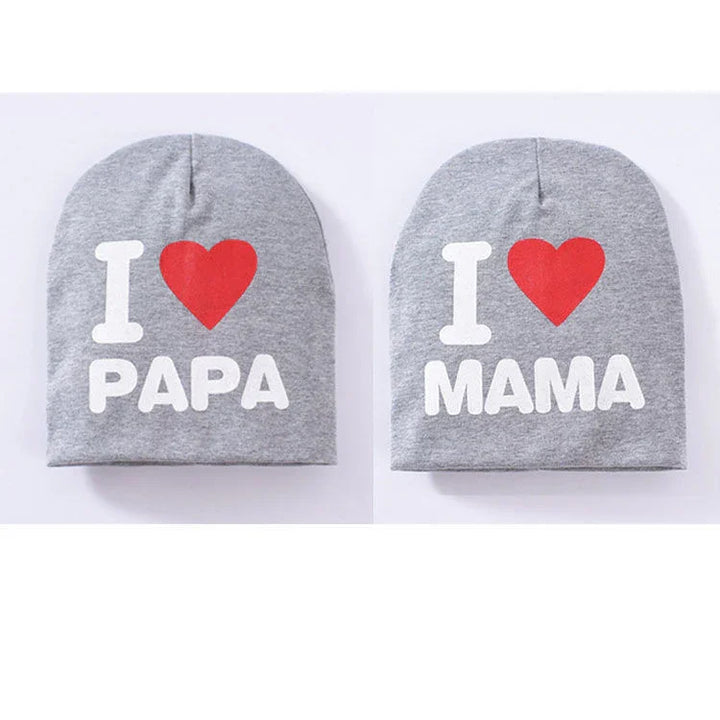 Two grey beanie hats with I love Papa and I love Mama printed in white and red