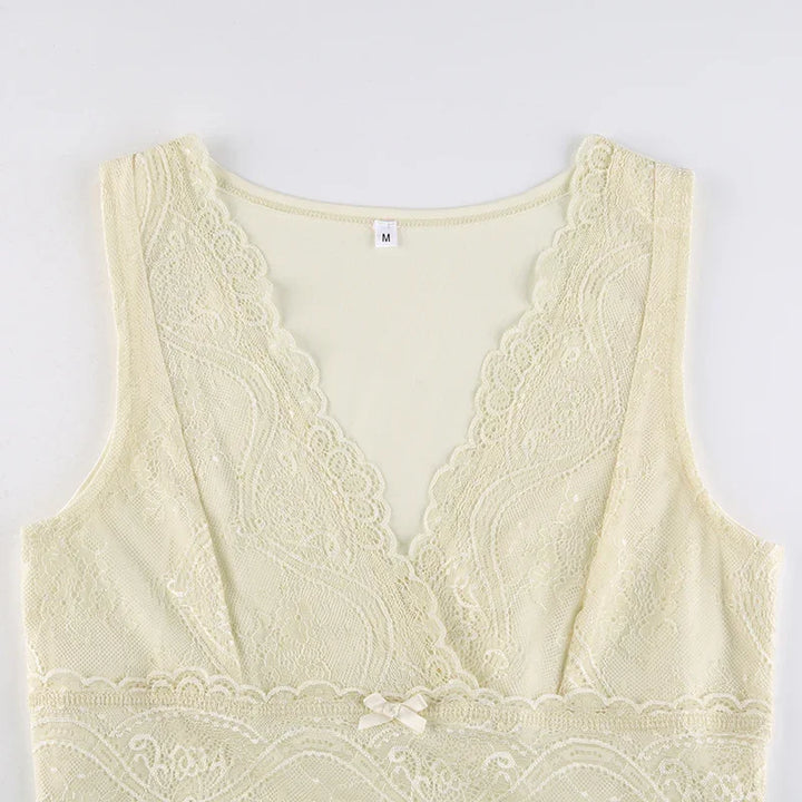 Ivory lace bralette with scalloped edges and small bow detail, size medium