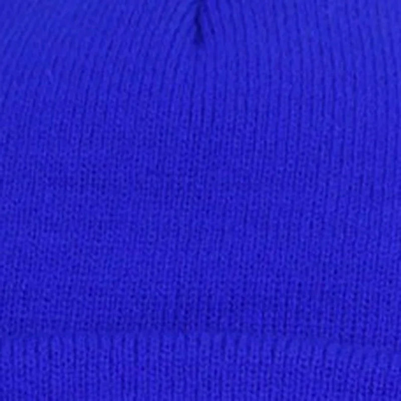 Close-up of vibrant blue knitted fabric with ribbed texture