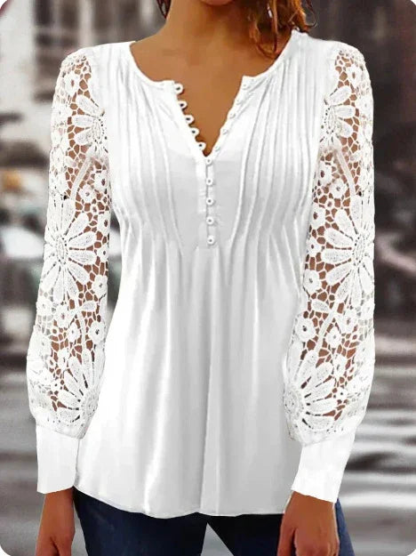 White long-sleeve blouse with lace floral sleeves and buttoned V-neck on woman
