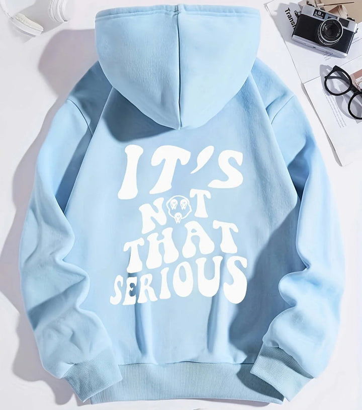 Light blue hoodie with white retro text saying "IT'S NOT THAT SERIOUS" and small graphic detail