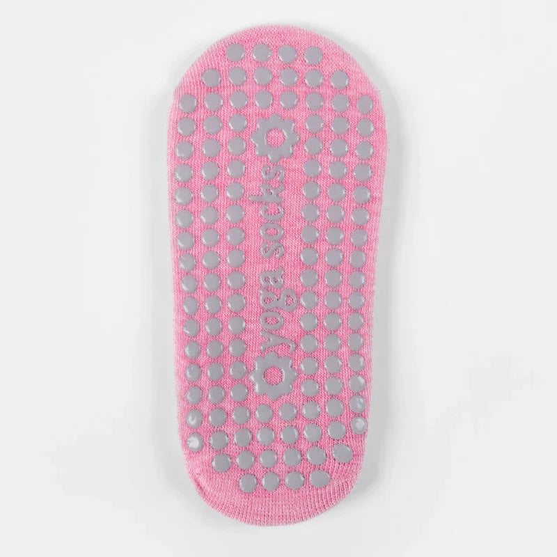 pink yoga socks with non-slip gray grips and yoga socks text on a white background