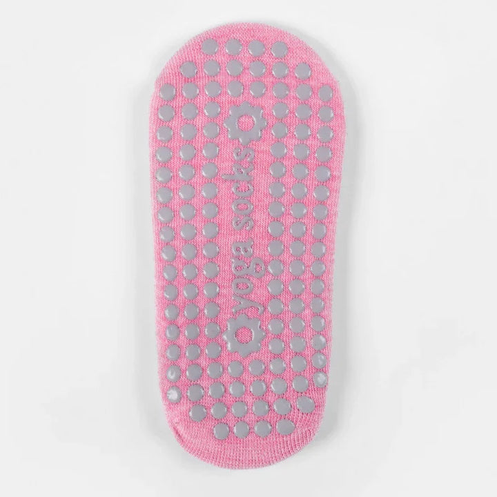 pink yoga socks with non-slip gray grips and yoga socks text on a white background