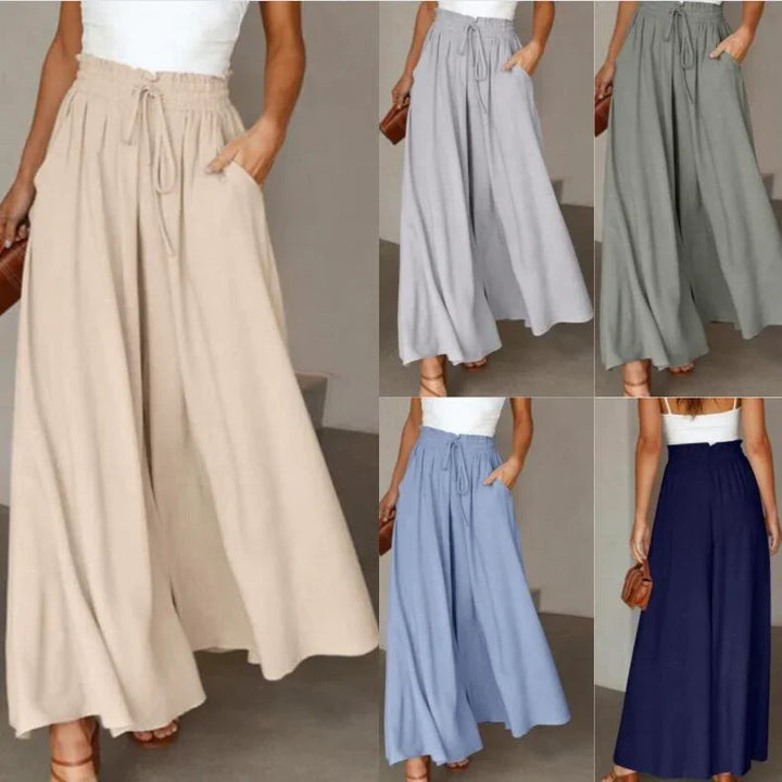 Women wearing casual wide-leg pants in beige, gray, olive, blue, and navy colors with drawstring waist.