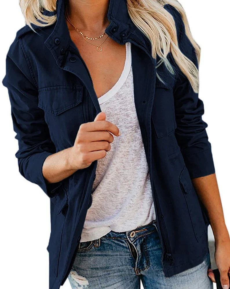 Woman wearing navy blue casual jacket over white t-shirt and distressed jeans