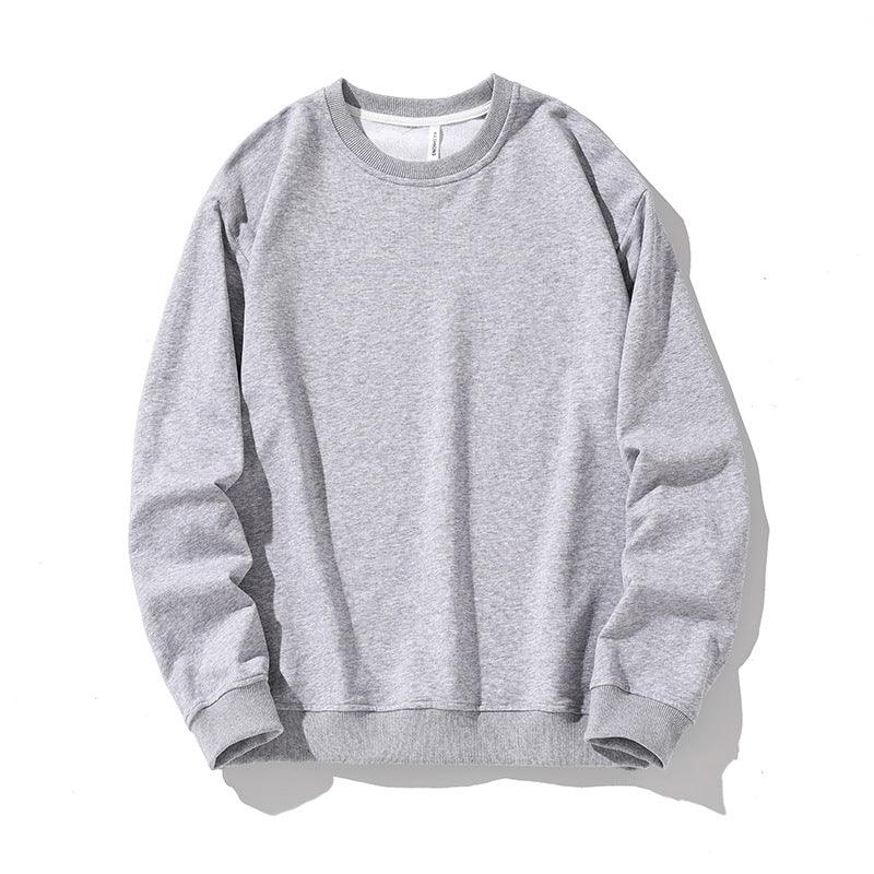 Light grey crewneck sweatshirt with ribbed collar, cuffs, and hem on white background