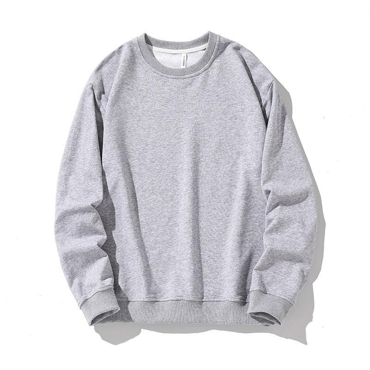 Light grey crewneck sweatshirt with ribbed collar, cuffs, and hem on white background